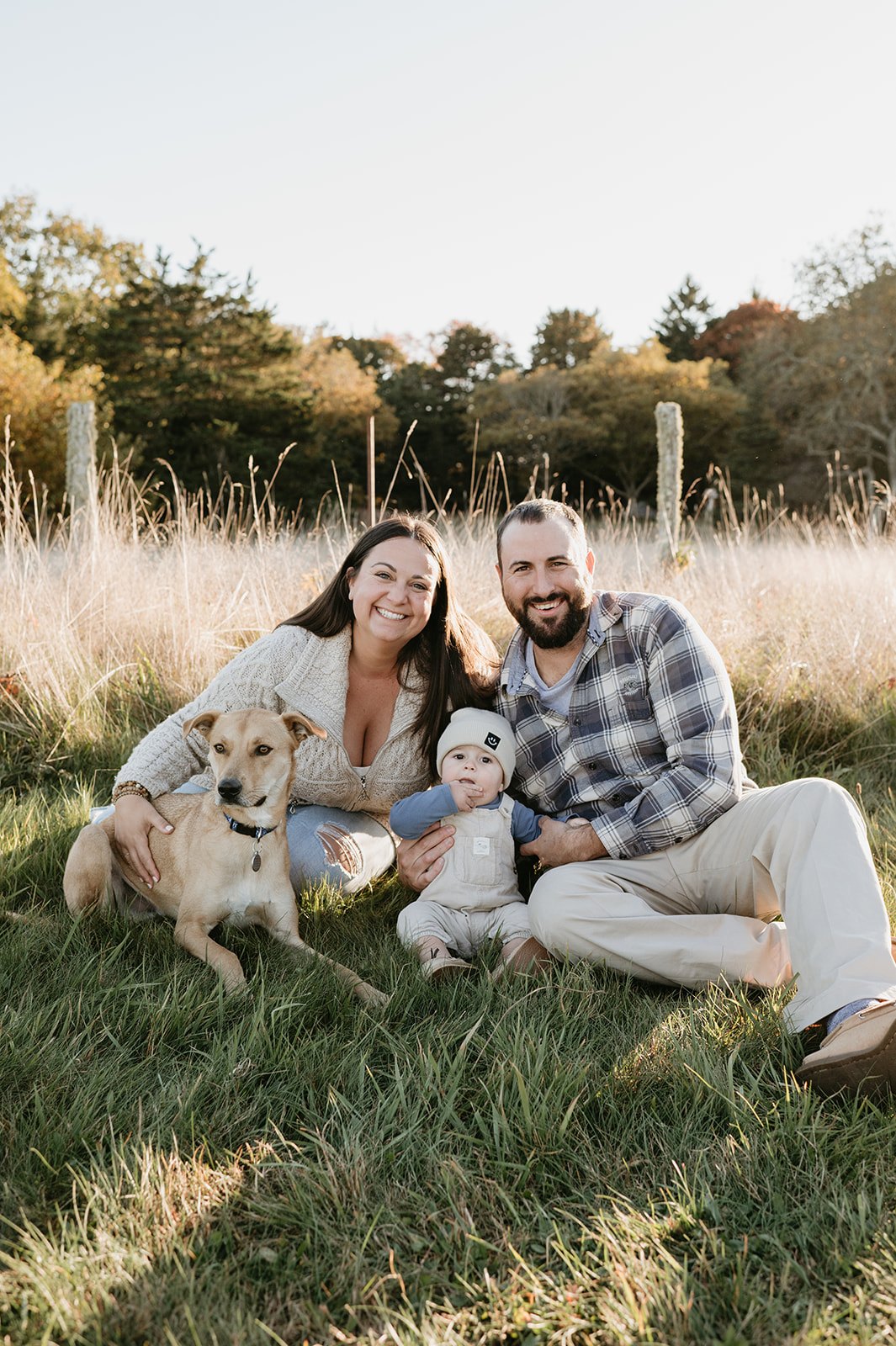 Allie with her family and dog spending time together outdoors